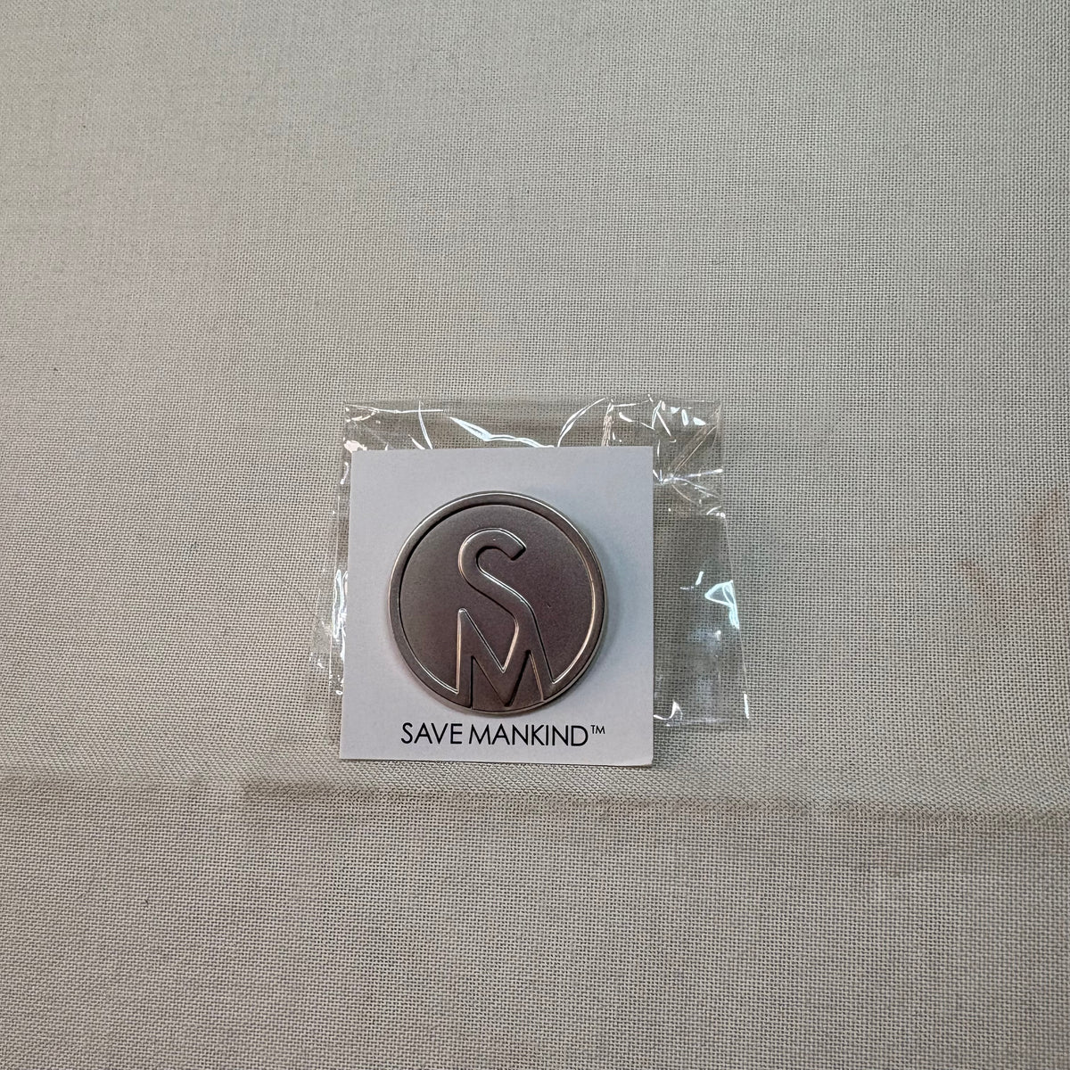 Save Mankind Circle Logo Pin